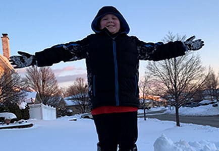 Makai standing on a pile of snow